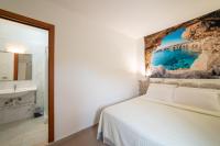 A bed or beds in a room at lidodubaihotel