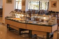 a buffet in a restaurant with plates and food at Blend Elphistone Resort Marsa Alam in Abu Dabab