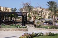 a park with a pavilion with flowers and palm trees at Blend Elphistone Resort Marsa Alam in Abu Dabab