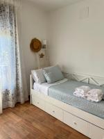 Postel nebo postele na pokoji v ubytování La casa de las Flores de El Hornillo