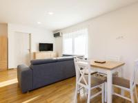 A television and/or entertainment centre at Holiday Home Honey by Interhome