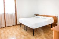 A bed or beds in a room at S305 - Sirolo, deliziosa villetta con portico