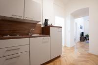 A kitchen or kitchenette at Modern hotel-styled apartment in the second district of Vienna.
