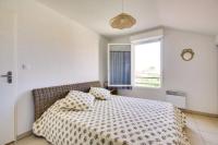 Łóżko lub łóżka w pokoju w obiekcie Agréable Appartement 3* non loin de l’Océan