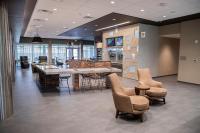 a lobby with a table and chairs in a building at Courtyard by Marriott Greenville Mauldin in Greenville