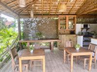 En terrasse eller udendørsområde på Pousada Vila Dendê