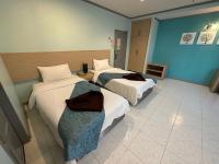 Postel nebo postele na pokoji v ubytování Thipurai City Hotel