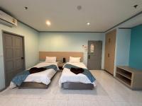 Postel nebo postele na pokoji v ubytování Thipurai City Hotel