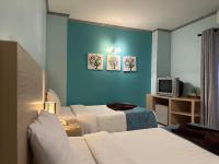 Postel nebo postele na pokoji v ubytování Thipurai City Hotel