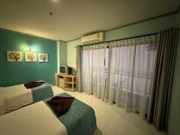 Postel nebo postele na pokoji v ubytování Thipurai City Hotel