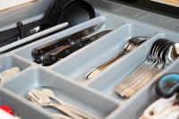 a drawer filled with utensils and silverware at Résidence Pompidou Libourne in Libourne