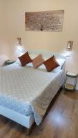 A bed or beds in a room at Glam Resort Luxury Lorenzo
