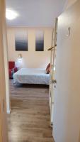 A bed or beds in a room at Glam Resort Luxury Lorenzo