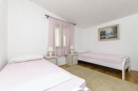 Postel nebo postele na pokoji v ubytování Apartments Juric
