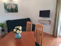 Televízia a/alebo spoločenská miestnosť v ubytovaní Residence Gordana