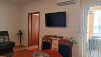 Televízia a/alebo spoločenská miestnosť v ubytovaní Residence Gordana
