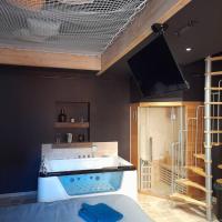 a bathroom with a large tub in a room at instant à deux in Précigné