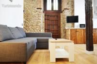 Televízia a/alebo spoločenská miestnosť v ubytovaní Apartamento Llerandi 2A - con terraza y totalmente reformado en un edificio histórico
