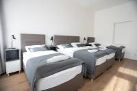 a room with four beds in a room at Residence St Havel Prague Old Town in Prague