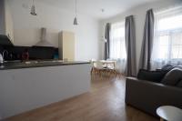 a kitchen and living room with a couch and a table at Residence St Havel Prague Old Town in Prague