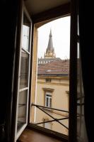 an open window with a view of a building at Le LOUIS XV halte romantique à Metz centre in Metz
