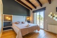 Łóżko lub łóżka w pokoju w obiekcie Muroo - 2520 Mallorca