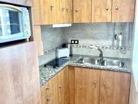 A kitchen or kitchenette at APARTBEACH ALBORAN 405 CON PISCINA y CLIMATIZADO