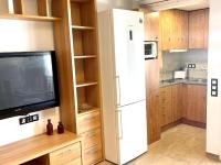 A kitchen or kitchenette at APARTBEACH ALBORAN 405 CON PISCINA y CLIMATIZADO