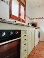 A kitchen or kitchenette at Apartaments Cel i Fusta