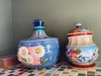 two vases sitting next to each other on a table at Raid Garden Boutique Hotel in Magong