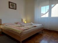 Posteľ alebo postele v izbe v ubytovaní Apartman Tinče