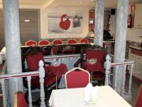 A restaurant or other place to eat at Hostal La Corte
