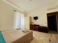 Łóżko lub łóżka w pokoju w obiekcie Mamamia #Lipari