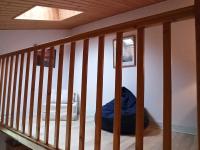 a staircase in a room with a crib at Maison Jard-sur-Mer, 3 pièces, 5 personnes - FR-1-485-78 in Jard-sur-Mer