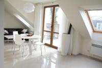 Televízia a/alebo spoločenská miestnosť v ubytovaní Apartament Morski