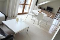 Televízia a/alebo spoločenská miestnosť v ubytovaní Apartament Morski