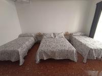 Posteľ alebo postele v izbe v ubytovaní Vivienda Agustín Durán