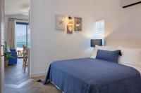 A bed or beds in a room at Ada Dreams City