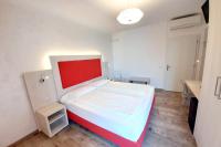 A bed or beds in a room at Hotel Da Tino