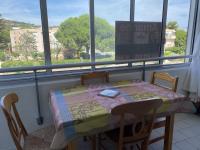 a table and chairs in a room with a window at Studio Sète, 1 pièce, 4 personnes - FR-1-338-406 in Sète