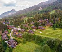 an aerial view of a village in the mountains at Resort Drevenice Terchova in Terchová