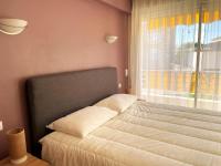 Łóżko lub łóżka w pokoju w obiekcie C012-Appartement confortable avec piscine, tennis et grand parc