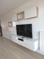 TV i/ili multimedijalni sistem u objektu Ker Romain - Sea View - 3 bedrooms Appt