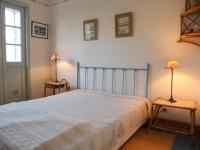 a bedroom with a bed and two lamps on tables at Maison Fouras, 6 pièces, 8 personnes - FR-1-709-39 in Fouras