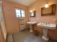 a bathroom with two sinks and a window at Maison Fouras, 6 pièces, 8 personnes - FR-1-709-39 in Fouras