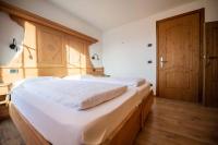 Posteľ alebo postele v izbe v ubytovaní Alpino Lodge Bivio