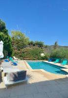 a swimming pool with lounge chairs at Villa Turquoise Sagone in Sagone