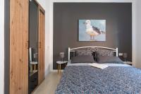 Łóżko lub łóżka w pokoju w obiekcie Apartment Libelle 5 star apartment in Krk!