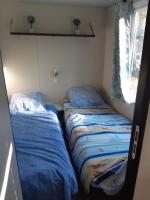 Posteľ alebo postele v izbe v ubytovaní Camping du Nizour