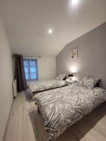 Posteľ alebo postele v izbe v ubytovaní Appartement Le Duplex
